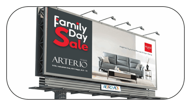 Large outdoor hoarding advertising billboard displaying Arterio Family Day Sale promotion on highway roadside